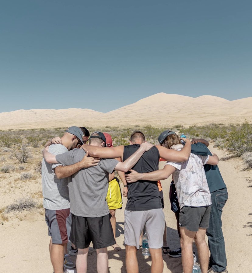 men praying together